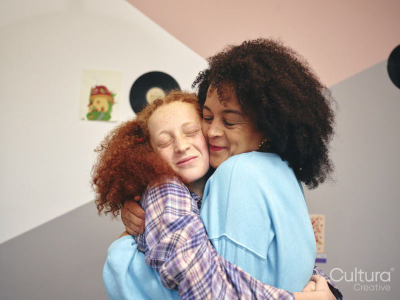 Mother and daughter embracing