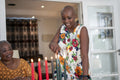 Smiling woman igniting Kwanzaa candles