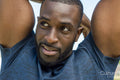 Portrait of mid adult man stretching