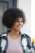 Smiling woman with curly hair