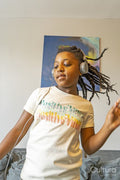 Girl with headphones dancing in living room