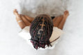Directly above view of young woman practicing yoga at home