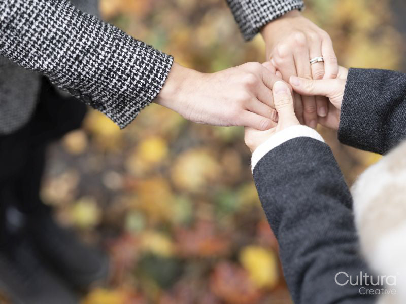 High angle of female couple holding hands