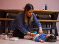 Mother caring for daughter with feeding tube