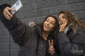 Two young women taking selfie
