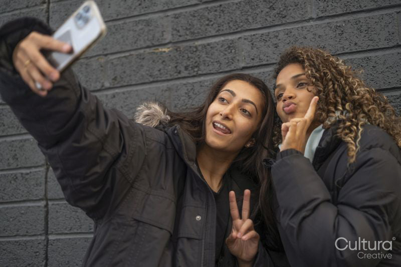 Two young women taking selfie