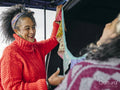 Women hanging decorations in van