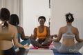 Women meditating in yoga studio