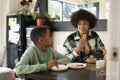 Mother and son eating at home