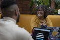 People using laptops in coworking space
