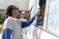 Young female friends buying ice cream in ice cream truck