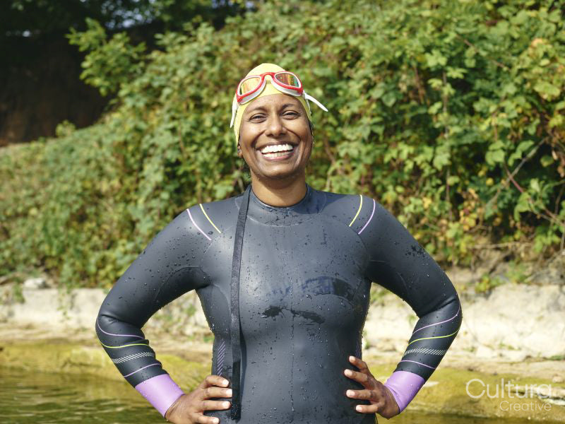 Portrait of smiling woman in wetsuit