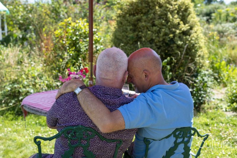 Senior male couple relaxing in garden