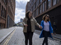 Happy couple walking on street