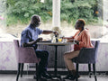 Mature couple enjoying breakfast in hotel
