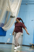 Senior woman playing badminton