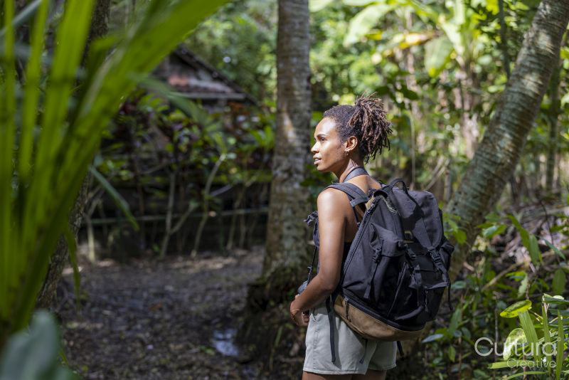 Indonesia, Bali, Female tourist hiking in rainforest