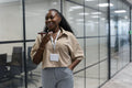 Happy businesswoman in office corridor
