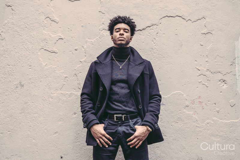 Pennsylvania, Philadelphia, Portrait of stylish man against white wall