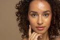 Studio portrait of woman with curly hair