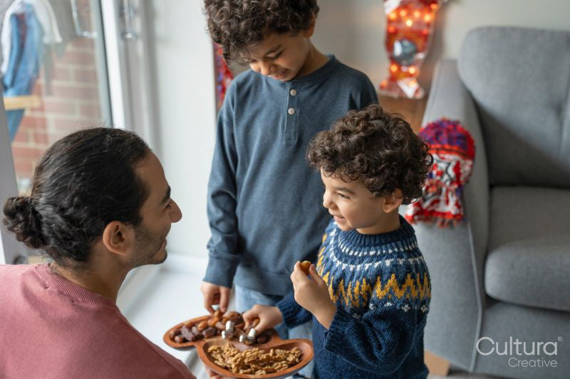Father and sons sharing food