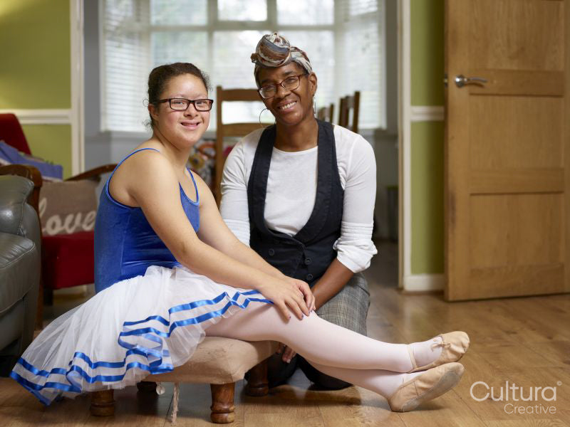 Portrait of mother and daughter with Down syndrome in ballerina costume