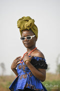 Portrait of young woman wearing headscarf and sunglasses