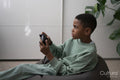 Boy playing video games at home