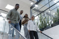 Office workers walking on steps