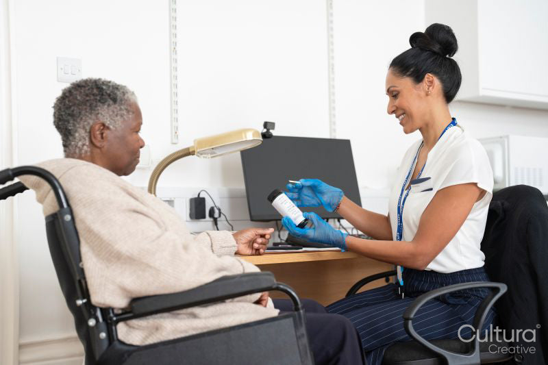 Smiling female doctor holding medical sample in office