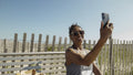 Senior woman having video call via smart phone
