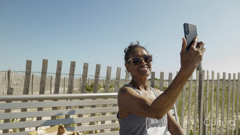 Senior woman having video call via smart phone