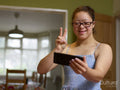 Girl with Down syndrome taking selfie