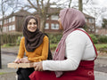 Female friends sitting in park