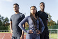 Portrait of group of athletes standing at stadium