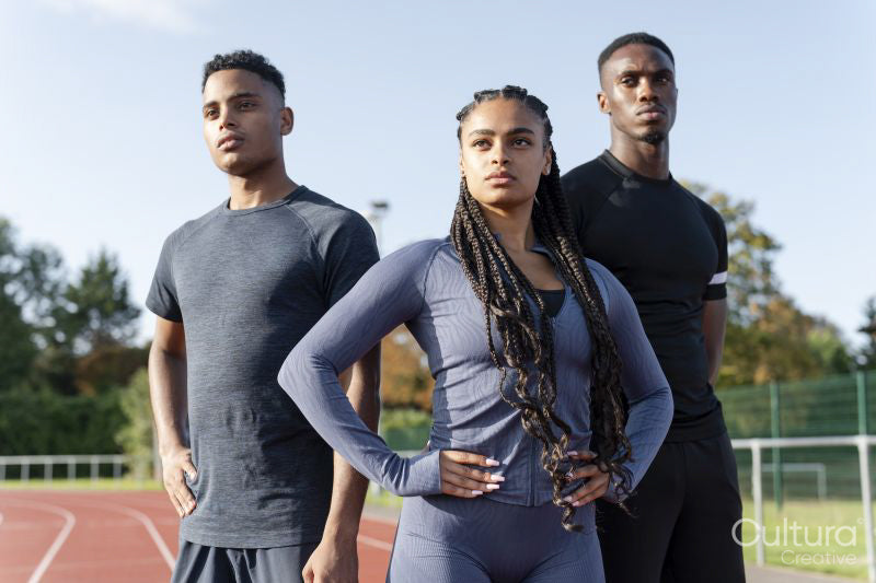 Portrait of group of athletes standing at stadium