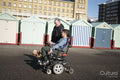Father and disabled son strolling with dog