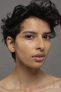 Studio portrait of shirtless woman