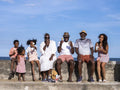 Portrait of family with children eating ice cream on beach