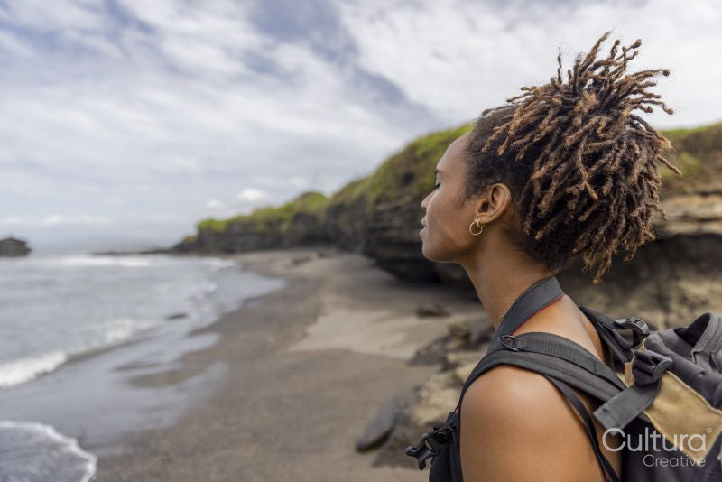 Indonesia, Bali, Female tourist looking at sea view