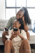 couple using smart phones at home