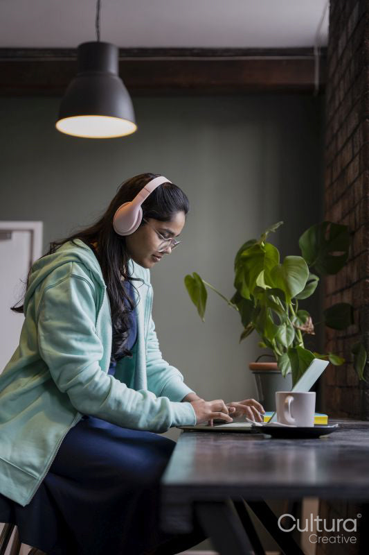 Female student using laptop while studying