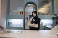 Portrait of female cafe owner at work