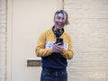 Portrait of laughing man with smart phone