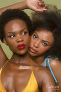Studio portrait of two women in bikini tops