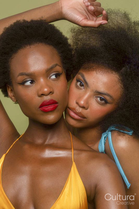 Studio portrait of two women in bikini tops