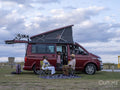 Family with girl camping in camper van