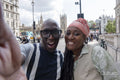 Happy mature couple visiting city