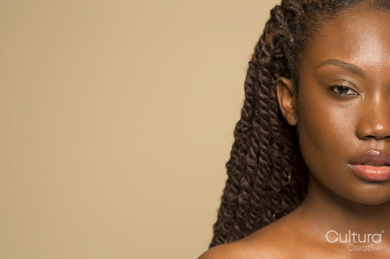 Studio portrait of woman with braided hair