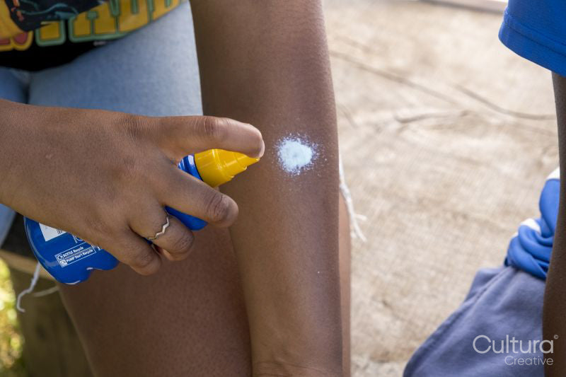 People applying sunscreen